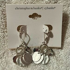 Silver discs that are a mix of hammered and shiny silver